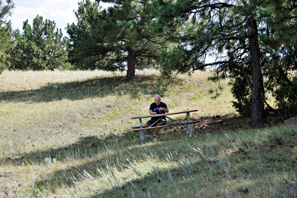 Lee Duquette at a slanted picnic table